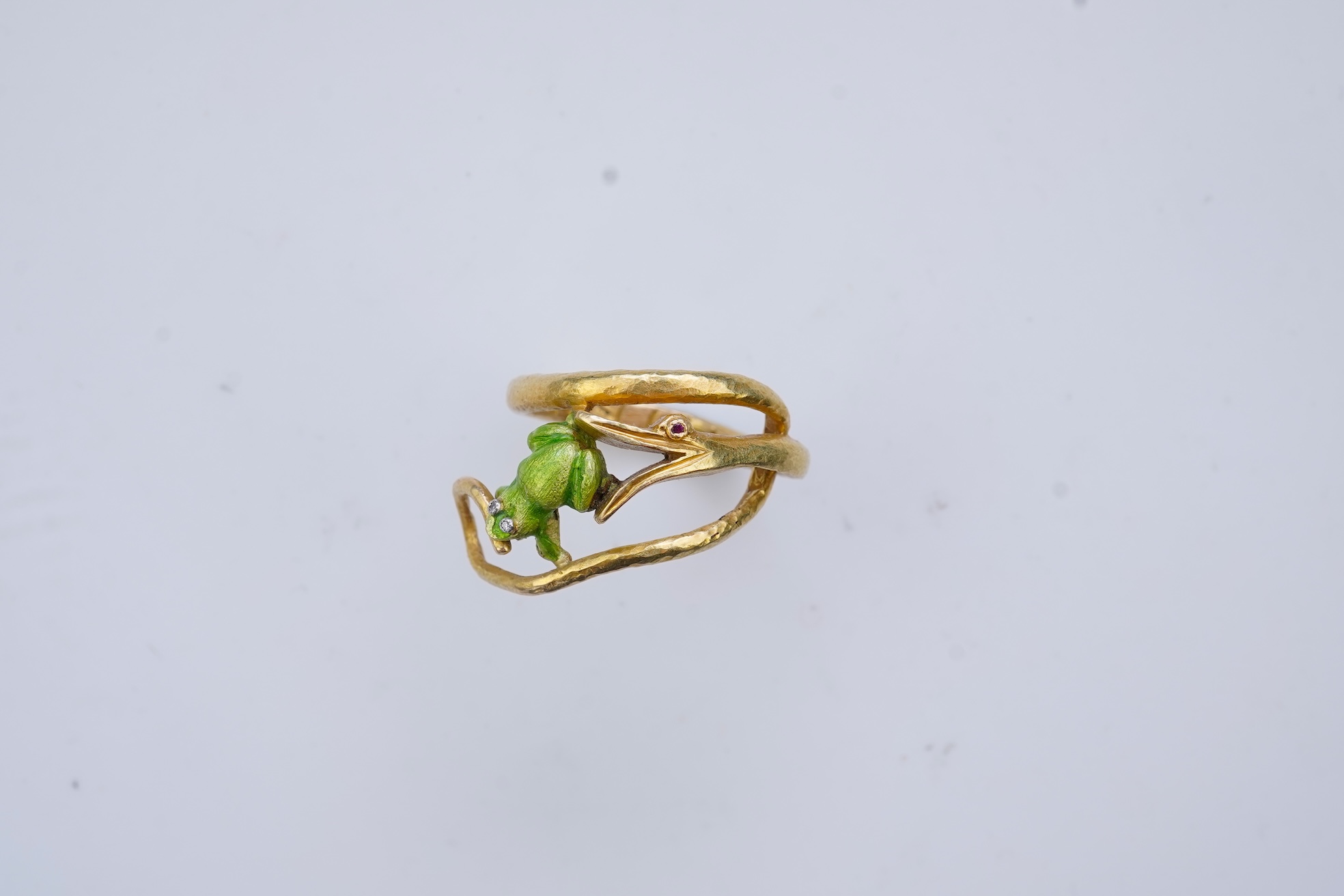 An unusual gold and enamel novelty ring